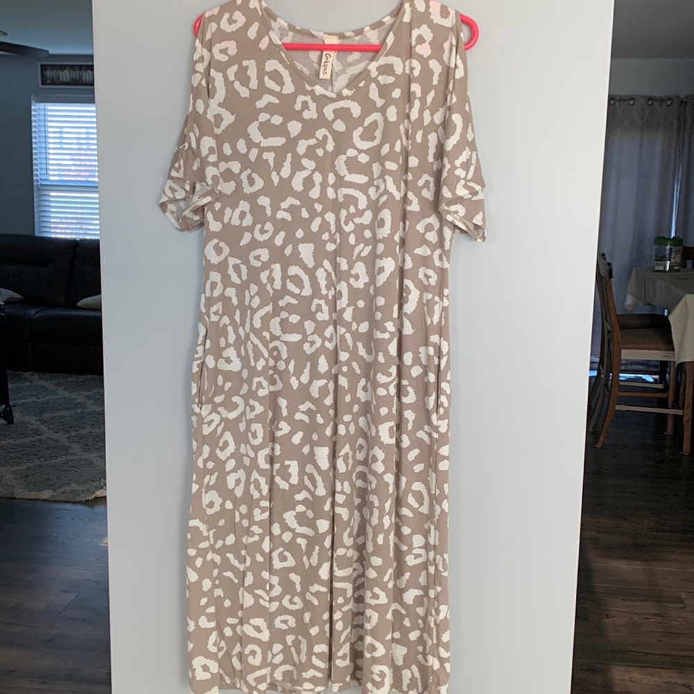 MIDI length super stretchy mocha and cream colored dress.
